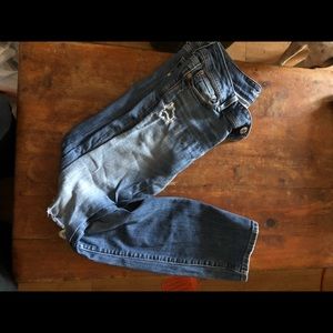 American Eagle ripped blue jeans